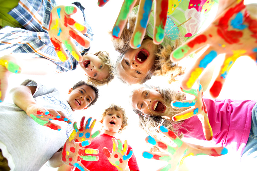 smiling kids with colourfull hands